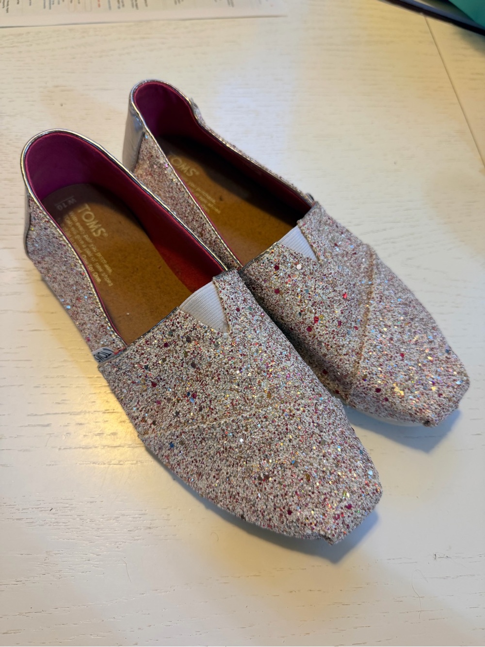 TOMS Women's Candy Cane Glitter Slip-Ons in Pink, white and gold
